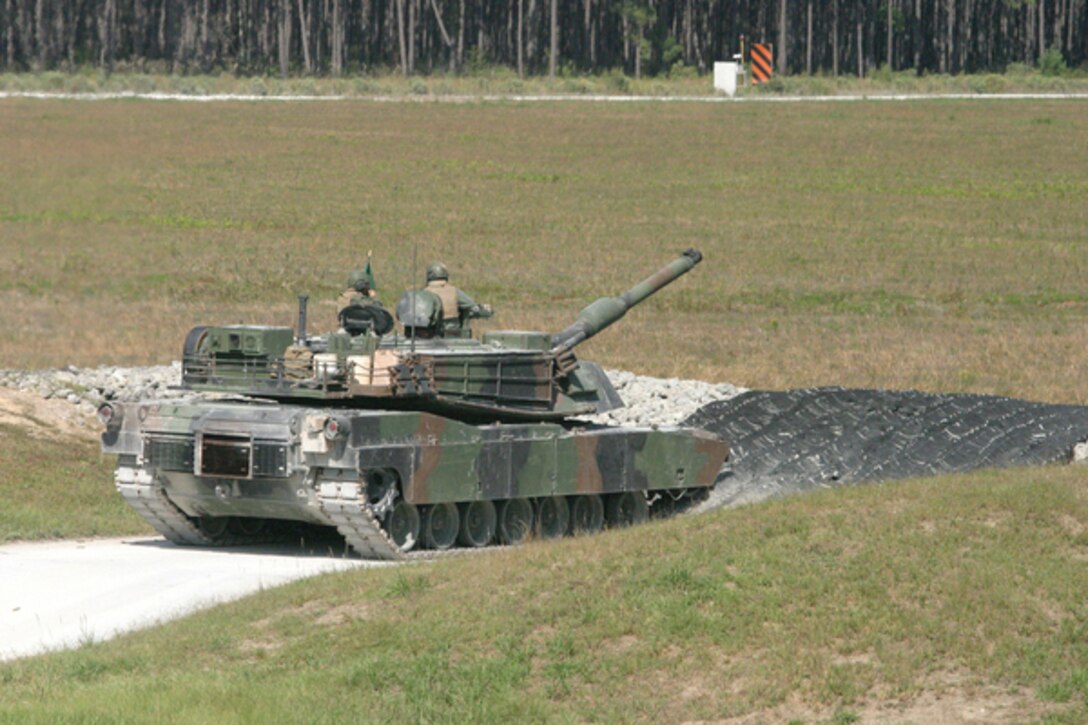 An M1A1 Abrams Main Battle Tank prepares to fire its 120 mm main gun during a gunnery range here Oct. 8.  Marines with 2nd Tank Battalion, 2nd Marine Division are required to qualify on live-fire tank ranges.  The M1A1 Abrams Main Battle Tank has been in America’s arsenal of armored fighting vehicles since 1980.  (Official Marine Corps photo by Staff Sgt. Juan Vara) (RELEASED)