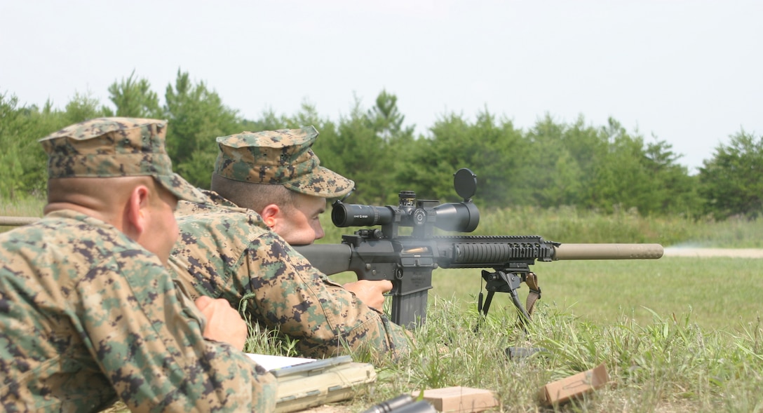 Marines of Scout Sniper Platoon, Battalion Landing Team 2nd Bn., 2nd Marine Regiment, shoot the MK-11 rifle, newest sniper rifle to the Marine Corps, for the first time during training at Fort A.P. Hill, Va., July 9, 2006. The Marines are training with the 26th Marine Expeditionary Unit for a planned deployment in early 2007. (Official USMC photo by Lance Cpl. Patrick M. Johnson-Campbell) (Released)