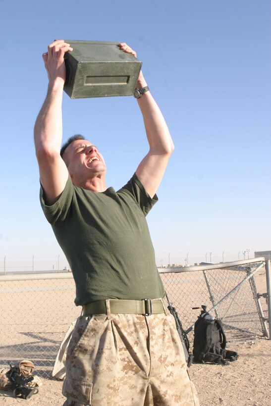 Corporal Mathew J. Brdecka from the 26th Marine Expeditionary Unit Command Element performs the ammo can lift portion of the Combat Fitness Test conducted during  sustainment training at Camp Buehring, Kuwait, Jan. 03, 2009. The 26th MEU is currently deployed to the U.S. Central Command Area of Operation as part of its 2008-2009 deployment. (Official USMC photo by Lance Cpl. Jacob W. Chase) (Released)::r::::n::