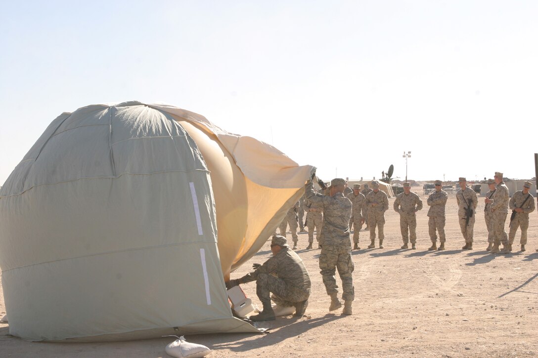 Arizona Air National Guard MSgt. Jake Martinez and Tech. Sgt. Craig Armstrong release the SkySat High Altitude Operational Payload system while leaders from the 26th Marine Expeditionary Unit observe the launch. SkySat could one day help Marines in the field with handheld radios communicate as far as 500 miles, regardless of terrain. 26th MEU Marines learned about the system Jan. 12 and got hands-on with the gear during the next several days.