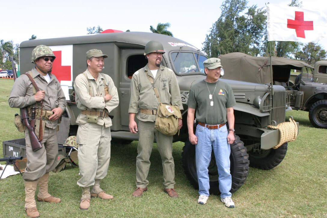 Members of the Hawaii Military Vehicle Preservation Association stand in front of a 1942 WC-54, 3/4-ton ambulance. From left to right: Dr. Eric Ako, Colin Chang, Jeffrey Wang, M.D., and Norman G.H. Wong.