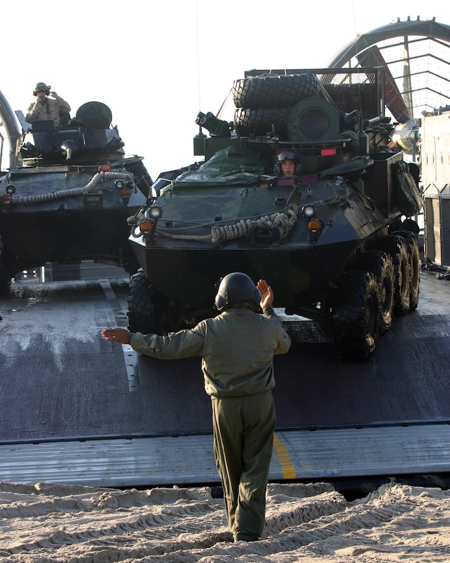 A Light Armored Vehicle rolls off of a Landing Craft Air-Cushioned landing craft before storming across the beach during a destruction raid exercise just in from the coast of Camp Lejeune, N.C., March 31, 2007. Light Armored Reconnaissance Platoon is attached to Battalion Landing Team, 3rd Battalion, 8th Marine Regiment, which is scheduled to deploy as the Ground Combat Element for the 22nd Marine Expeditionary Unit later this year. (U.S. Marine Corps photo by Sgt. Ezekiel R. Kitandwe)