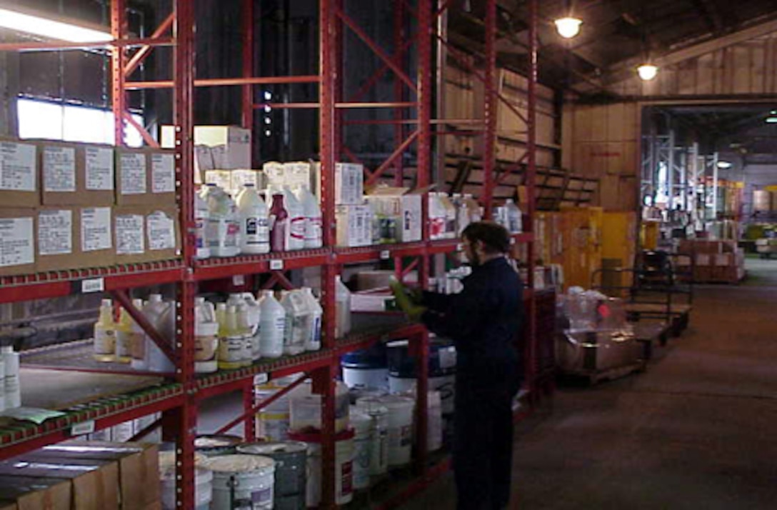 MARINE CORPS BASE CAMP LEJEUNE, N.C. - A worker takes inventory at the Hazardous Material Control Center in building 977. The HMCC, located on Michael Street, reissues serviceable hazardous materials back to various units instead of being disposed of as hazardous waste. (photo courtesty os the Hazardous Material Control Center)