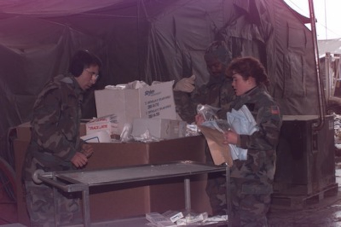 Remaining medical supplies are packed into large boxes on Dec. 4, 1995, as part of the closing of the U.S. Hospital Zagreb at Camp Pleso, Zagreb, Croatia. The tents of the hospital are being emptied of medical equipment and supplies and taken down by the 74th Medical Group (Provisional), of Wright-Patterson Air Force Base, Ohio. The hospital has served the United Nations Protection Force since November of 1992. 