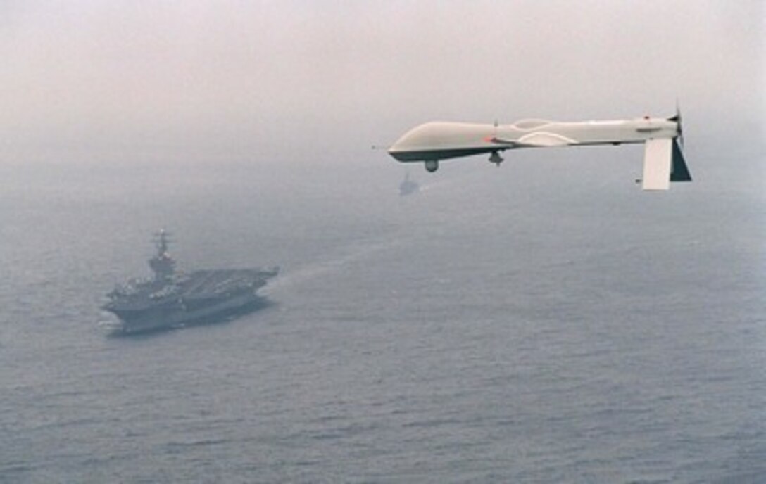 Predator Unmanned Aerial Vehicle (UAV) flies above the aircraft carrier USS Carl Vinson (CVN 70) on a simulated Navy aerial reconnaissance flight off the coast of southern California on Dec. 5, 1995. The Predator provides near, real-time infrared and color video to intelligence analysts and controllers on the ground and the ship. This is the Predator's first maritime mission with a carrier battle group. The UAV was launched from San Nicholas Island off the coast of southern California. 