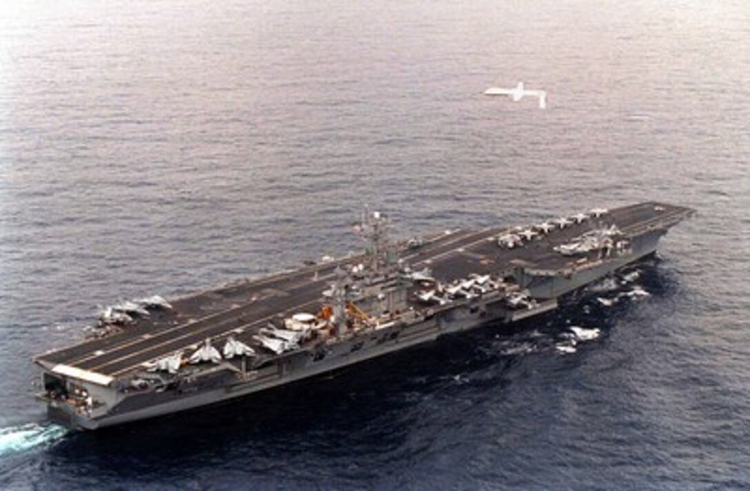 A Predator Unmanned Aerial Vehicle (UAV) flies above the aircraft carrier USS Carl Vinson (CVN 70) on a simulated Navy aerial reconnaissance flight off the coast of southern California on Dec. 5, 1995. The Predator provides near, real-time infrared and color video to intelligence analysts and controllers on the ground and the ship. This is the Predator's first maritime mission with a carrier battle group. The UAV was launched from San Nicholas Island off the coast of southern California. 