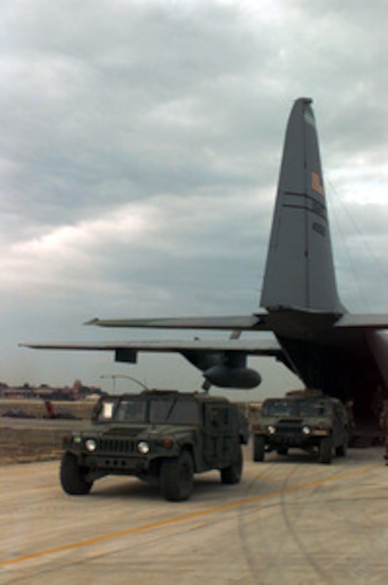 Two U.S. Army Humvee's are loaded into a U.S. Air Force C-130 Hercules at Brindisi Italian Air Station, Italy, on Dec. 18, 1995. The Humvee's will be flown to Sarajevo, Bosnia and Herzegovina, to support the NATO Enabling Force of Operation Joint Endeavor. Enabling forces are moving into the Croatia, Bosnia and Herzegovina, and Slovenia theaters of operation to prepare entry points for the main Implementation Force. The Humvee's belong to the 3rd Battalion, 10th Special Forces, Fort Carson, Colo. 