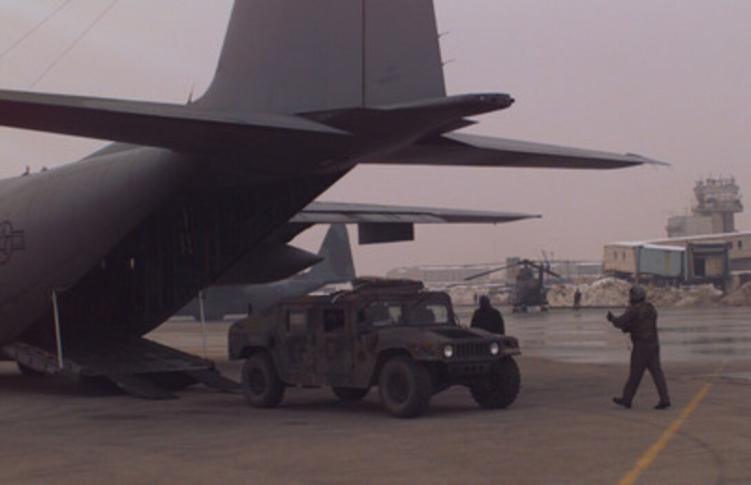 A U.S. Army Humvee is unloaded from a U.S. Air Force C-130 Hercules at the airport in Sarajevo, Bosnia and Herzegovina, on Dec. 18, 1995. The Humvee will be used to support the NATO Enabling Force of Operation Joint Endeavor. Enabling forces are moving into the Croatia, Bosnia and Herzegovina, and Slovenia theaters of operation to prepare entry points for the main Implementation Force. The Humvee belongs to the 3rd Battalion, 10th Special Forces, Fort Carson, Colo. 