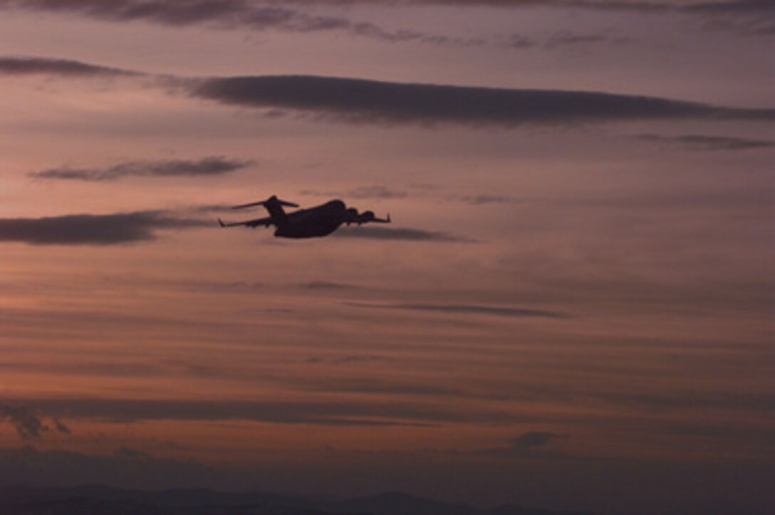 A U.S. Air Force C-17 Globemaster III takes off from Tuzla Air Base, Bosnia and Herzegovina, on Dec. 22, 1995, after delivering cargo and passengers in support of the NATO's Operation Joint Endeavor. The cargo and soldiers are part of the NATO Implementation Force (IFOR) in Bosnia and Herzegovina. The C-17 is returning to Rhein Main Air Base, Germany. 