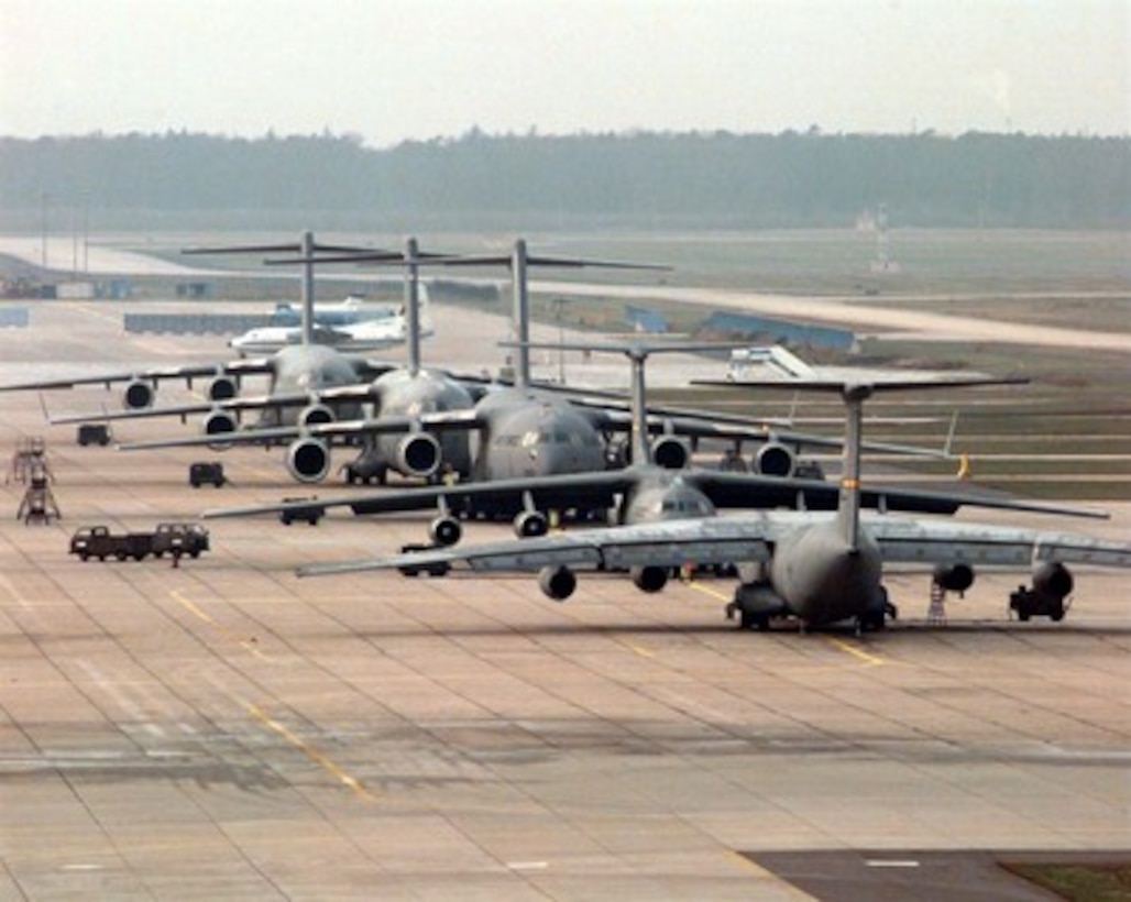 U.S. Air Force C-17 Globemasters and C-141 Starlifters are parked on the ramp at Rhein-Main Air Base, Germany, on Dec. 26, 1995. The aircraft are being used to deploy troops and equipment for the NATO Implementation Force (IFOR) in Bosnia and Herzegovina and neighboring countries in support of Operation Joint Endeavor. 