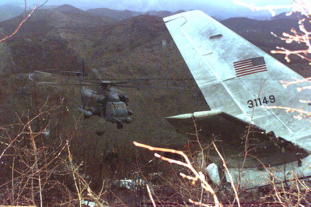 A U.S. Air Force MH-53J Pave Low helicopter makes an approach on April 4, 1996, to the site where wreckage of the U.S. Air Force T-43A which crashed on April 3 while carrying Commerce Secretary Ronald H. Brown and his delegation is scattered on a hillside approximately 3 kilometers north of the Dubrovnik Airport in Croatia. Military and civilian investigators are sifting through the wreckage to determine the cause of the crash. 