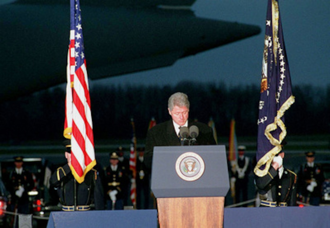 President Bill Clinton addresses family members, Department of Commerce employees and government officials gathered at Dover Air Force Base, Del., on April 6, 1996, for the arrival of the remains of Commerce Secretary Ron Brown and other members of the Commerce mission to Bosnia and Herzegovina who were killed in a plane crash near Dubrovnik, Croatia, on April 3. 