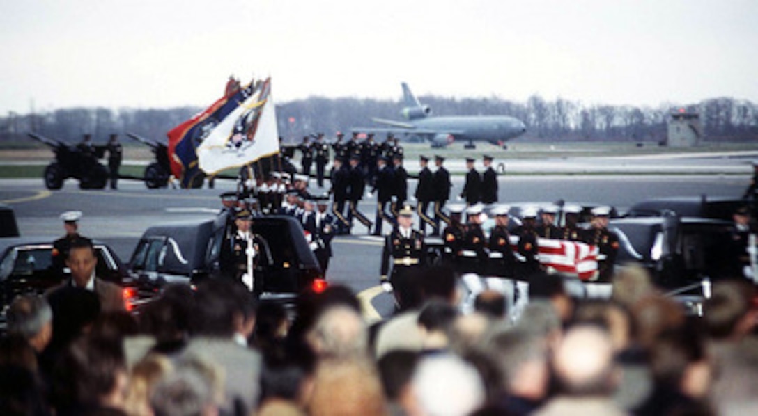 Members of the Joint Ceremonial Honor Guard carry the remains of Commerce Secretary Ron Brown and other members of the Commerce mission to Bosnia and Herzegovina who were killed in a plane crash near Dubrovnik, Croatia, on April 3 to waiting hearses at Dover Air Force Base, Del., on April 6, 1996. 
