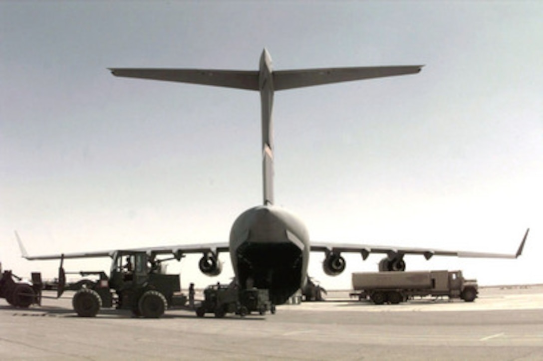 A U.S. Air Force C-17A Globemaster III is unloaded and refueled at a Jordanian Air Base on April 4, 1996. The aircraft is delivering cargo, support equipment and personnel for a U.S. Air Force Air Power Expeditionary Force which will operate out of Jordan. The Expeditionary Force will provide additional land-based air forces to augment regional assets. The deployment will also give the Air Force an opportunity to work and train with coalition partners in the region. The deployment should be completed near the end of June 1996. The Globemaster is deployed from the 14th Airlift Squadron, Charleston Air Force Base, S.C. 