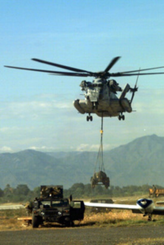 U.S. Marine Corps CH-53 Sea Stallion helicopters, like this one shown in a file photo operating in Haiti, are embarked onboard the amphibious assault ship USS Guam (LPH 9). President Clinton has ordered the Guam to steam towards the coast of Liberia to assist in the evacuation of U.S. citizens and foreign nationals known as Operation Assured Response. Joining the Guam will be the amphibious transport dock ship USS Trenton (LPD 14) and the dock landing ship USS Portland (LSD 37). All three ships are designed to support amphibious operations via helicopters or landing craft. The Guam also carries a complement of Marine CH-46 Sea Knight helicopters. 