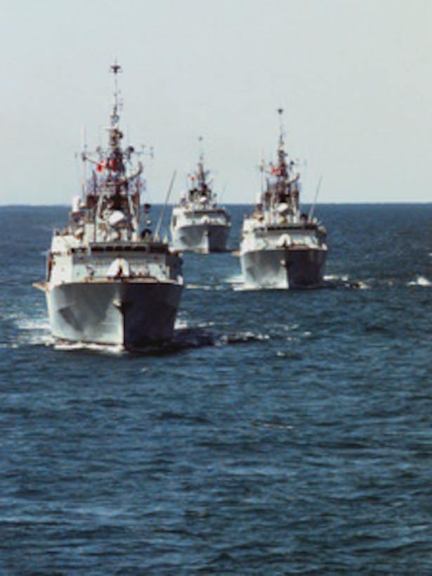 Three Canadian destroyers steam in formation off the coast of Florida on March 23, 1996. The ships are part of an armada from seven NATO nations participating in Exercise Unified Spirit '96. The combined exercise is designed to improve the readiness and effectiveness of NATO forces in the areas of command communication, embargo enforcement, freedom of navigation and protection and coordination with mine warfare forces. 