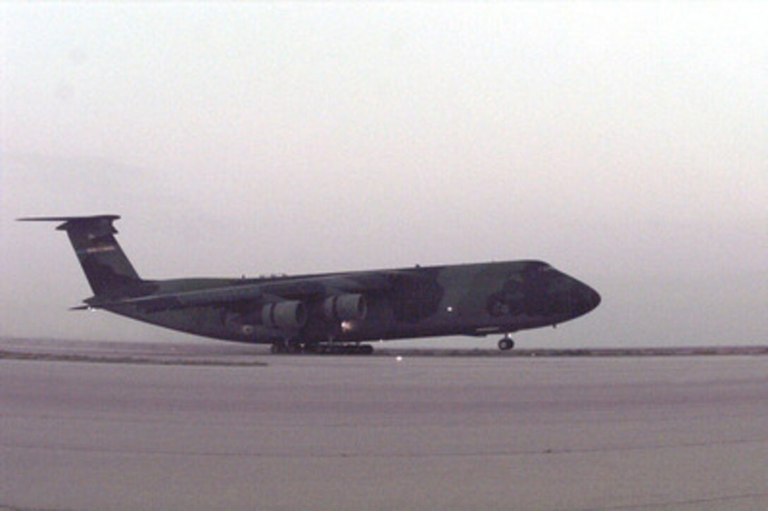 A U.S. Air Force C-5A Galaxy lands at Azraq Air Force Base, Jordan, on April 12, 1996. The aircraft is carrying cargo, support equipment and personnel for a U.S. Air Force Air Power Expeditionary Force which will operate out of Jordan. The Expeditionary Force will provide additional land-based air forces to augment regional assets. The deployment will also give the Air Force an opportunity to work and train with coalition partners in the region. The deployment should be completed near the end of June 1996. The Galaxy is deployed from the 3rd Airlift Squadron, Dover Air Force Base, Del. 