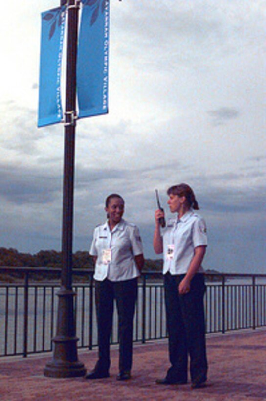 Staff Sgt. Stainer and Staff Sgt. Harding of the 165 Airlift Wing, Savannah, Ga., are patrolling the river walk of the Marriott, Olympic village, in Savannah during the 1996 Summer Olympic games. DOD photo