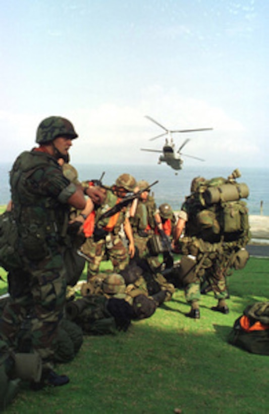 U.S. Marines from Special Purpose Marine Air Ground Task Force Liberia, arrive at the U.S. Embassy in Monrovia, Liberia, in a CH-46 Sea Knight helicopter on June 27, 1996. The task force deployed from Camp Lejeune, N. C., took over the security mission at the embassy from the 22nd Marine Expeditionary Unit. 
