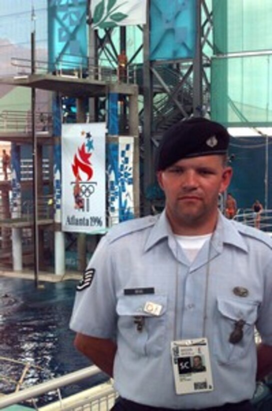 Staff Sgt. David Bean, 121 Security Police Squadron-Ohio Air National Guard, stands watch for any suspicious activity at the Aquatic Center on 30 July 1996. 