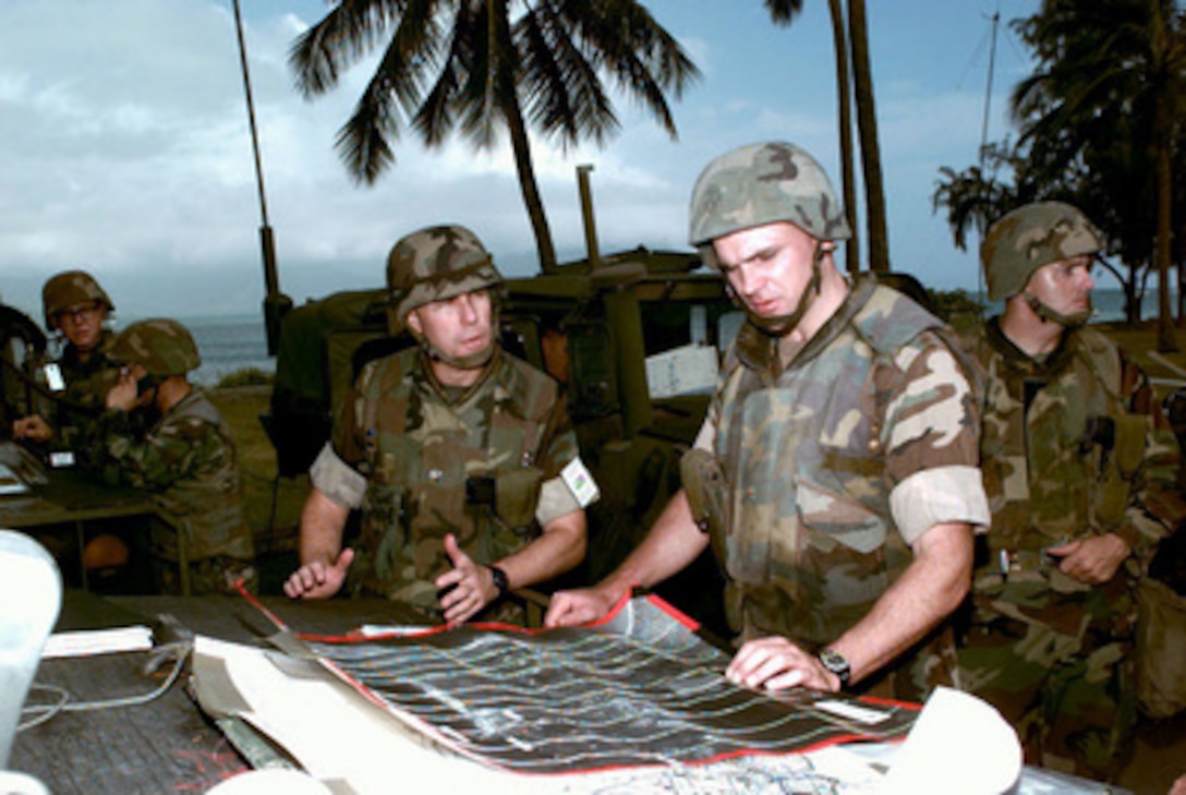 U.S. Marine officers review their perimeter security at a simulated U.S. Embassy in the fictitious country of Pacifica during a Noncombatant Evacuation Operation exercise on June 11, 1996, at Kaneohe Bay Marine Corps Station, Hawaii, as part of exercise RIMPAC '96. More than 44 ships, 200 aircraft and 30,000 soldiers, sailors, Marines, airmen and Coast Guardsmen are involved in the exercise. The purpose of RIMPAC '96 is to improve coordination and interoperability of combined and joint forces in maritime tactical and theater operations. Australia, Canada, Chile, Japan, the Republic of Korea and the U.S. are participating in the exercise. 