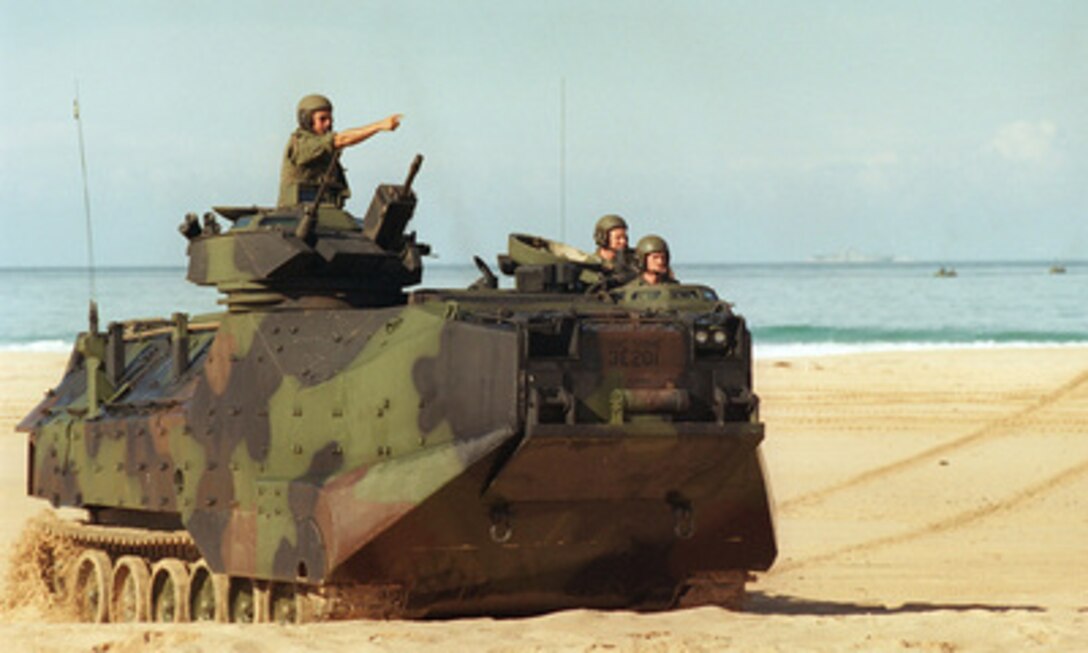 A U.S. Marine Corps Amphibious Assault Vehicle maneuvers on the beach during an amphibious landing on June 15, 1996, as part of RIMPAC '96. The amphibious assault at Pacific Missile Range Facility, Barking Sands, Hawaii, is being conducted by 11th Marine Expeditionary Unit, Camp Pendleton, Calif., and involves Navy and Marine air, ground and sea forces for training as a combined amphibious assault force. More than 44 ships, 200 aircraft and 30,000 soldiers, sailors, Marines, airmen and Coast Guardsmen are involved in the exercise. The purpose of RIMPAC '96 is to improve coordination and interoperability of combined and joint forces in maritime tactical and theater operations. Australia, Canada, Chile, Japan, the Republic of Korea and the U.S. are participating in the exercise. 