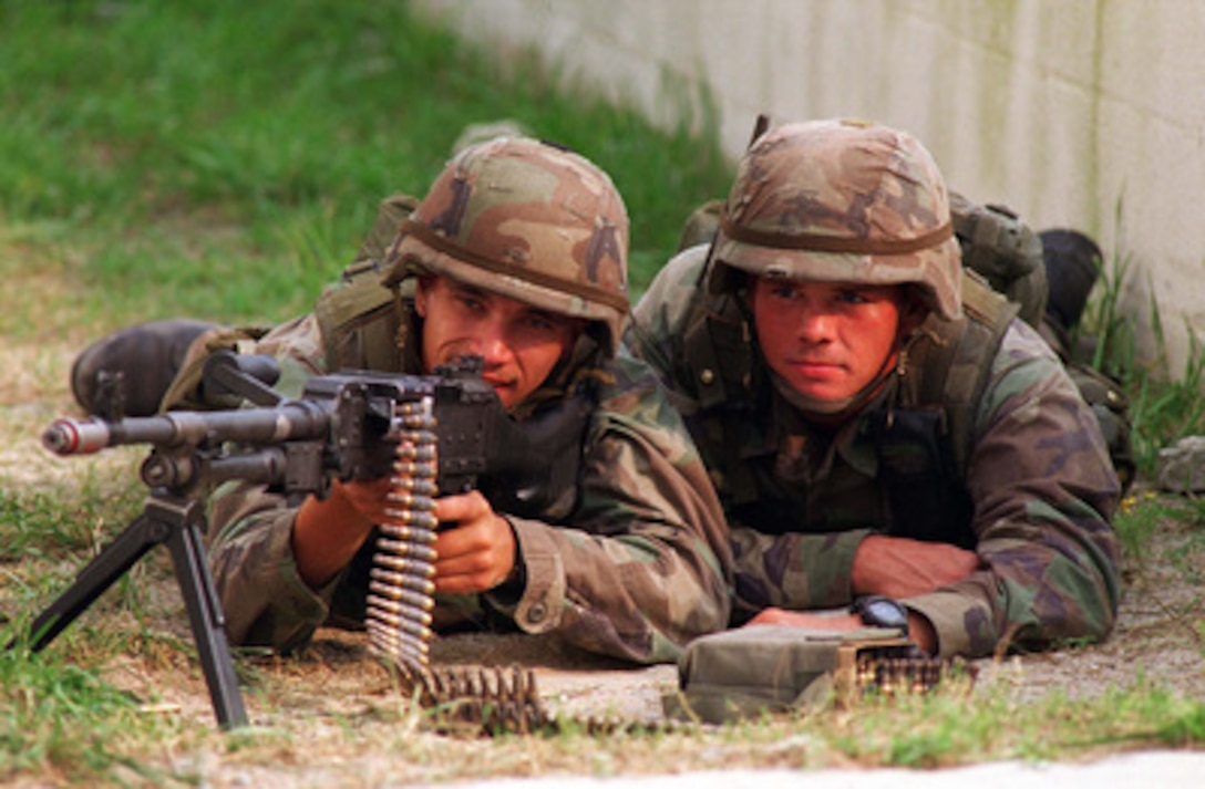 U.S. Marines sight in with an M-240G machine gun at Camp Lejeune.