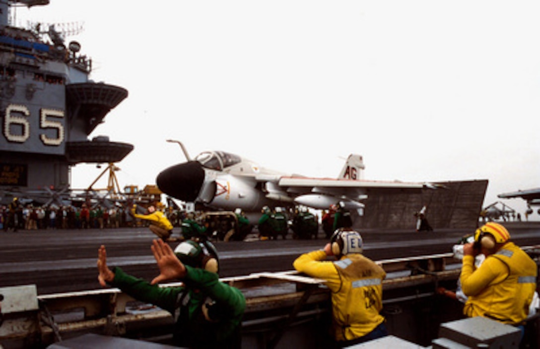 A U.S. Navy A-6E Intruder receives the signal to launch from catapult three of the aircraft carrier USS Enterprise (CVN 65), on Dec. 19, 1996, marking the last Intruder squadron to fly from the deck of an aircraft carrier. The Intruder, from Attack Squadron 75, Naval Air Station Oceana, Va., sports the AG tail code and paint scheme representing Carrier Air Wing 7, the squadron's first air wing over 30 years ago. The squadron, known as the Sunday Punchers, will be decommissioned in early 1997. 