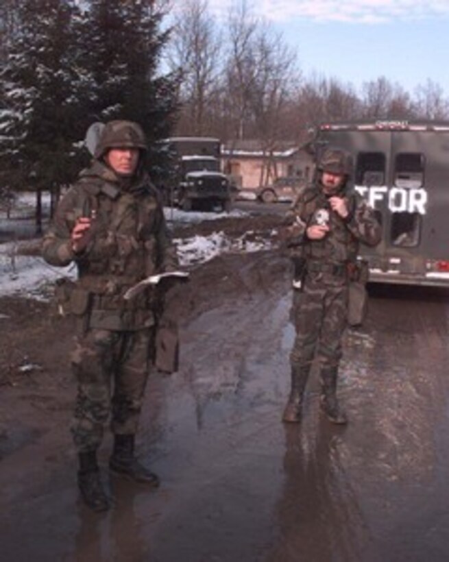 A U.S. Air Force security policeman gives a briefing on procedures and protocol prior to escorting a convoy into Tuzla, Bosnia and Herzegovina, on Jan. 23, 1996, during Operation Joint Endeavor. He and other members of the 48th Security Police Squadron, RAF Lakenheath, United Kingdom, are deployed to Tuzla Air Base as part of the NATO Implementation Force (IFOR) in Bosnia and Herzegovina. 