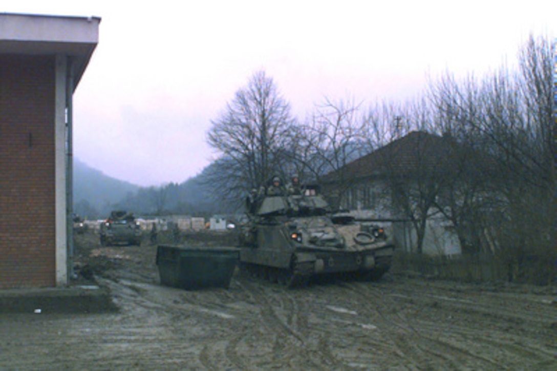 A convoy of Bradley Fighting Vehicles from the 2nd Brigade, 1st Armored Division, Baumholder, Germany, starts out for the Zone of Separation in Bosnia and Herzegovina on Jan. 29, 1996, during Operation Joint Endeavor. The Bradley's will provide security for U.S. Army combat engineers as they destroy prohibited bunkers in the Zone of Separation. The soldiers are part of the NATO Implementation Force (IFOR). 