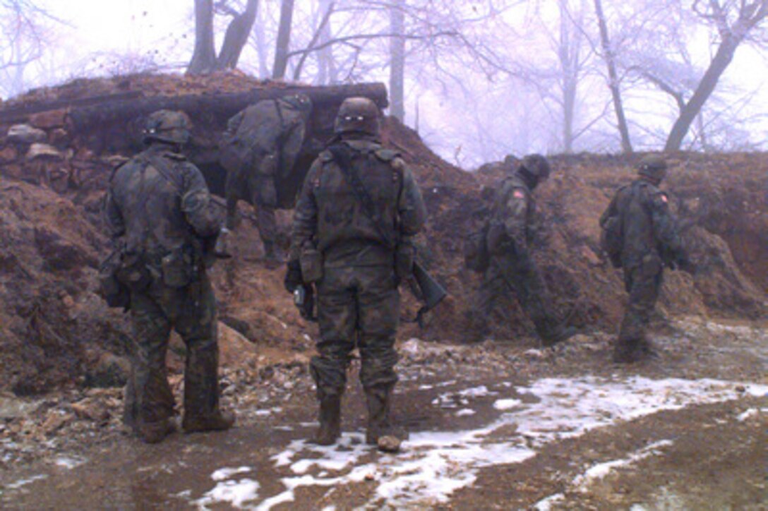 U.S. Army combat engineers prepare to blow up a prohibited Serbian bunker in the Zone of Separation in Bosnia and Herzegovina on Jan. 29, 1996, during Operation Joint Endeavor. The engineers are from 40th Engineers, 2nd Brigade, 1st Armored Division, Baumholder, Germany. The engineers are part of the NATO Implementation Force (IFOR). 