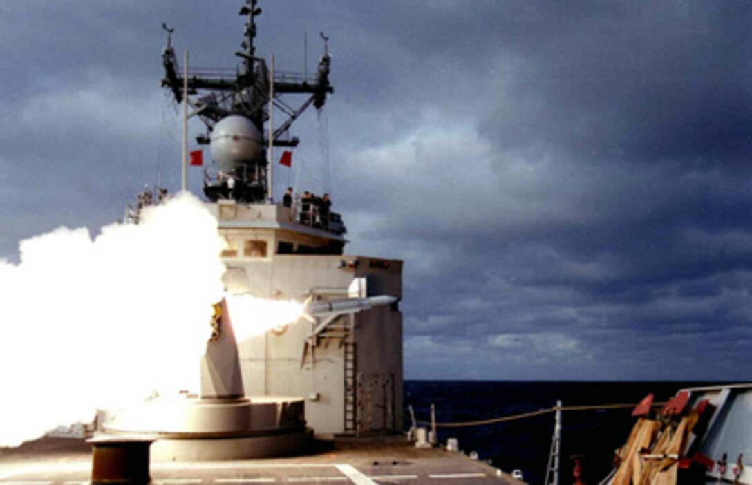 A Standard Missile roars off the forward launcher of the USS Thach (FFG 43) heading toward an incoming target drone during a missile test exercise in the South China Sea on Jan. 9, 1996. The Standard Missile used on the Oliver Hazard Perry Class Frigate is a SM-1 MR (medium range) surface-to-air or surface-to-surface missile that can be used against aircraft, ships and other missiles. 