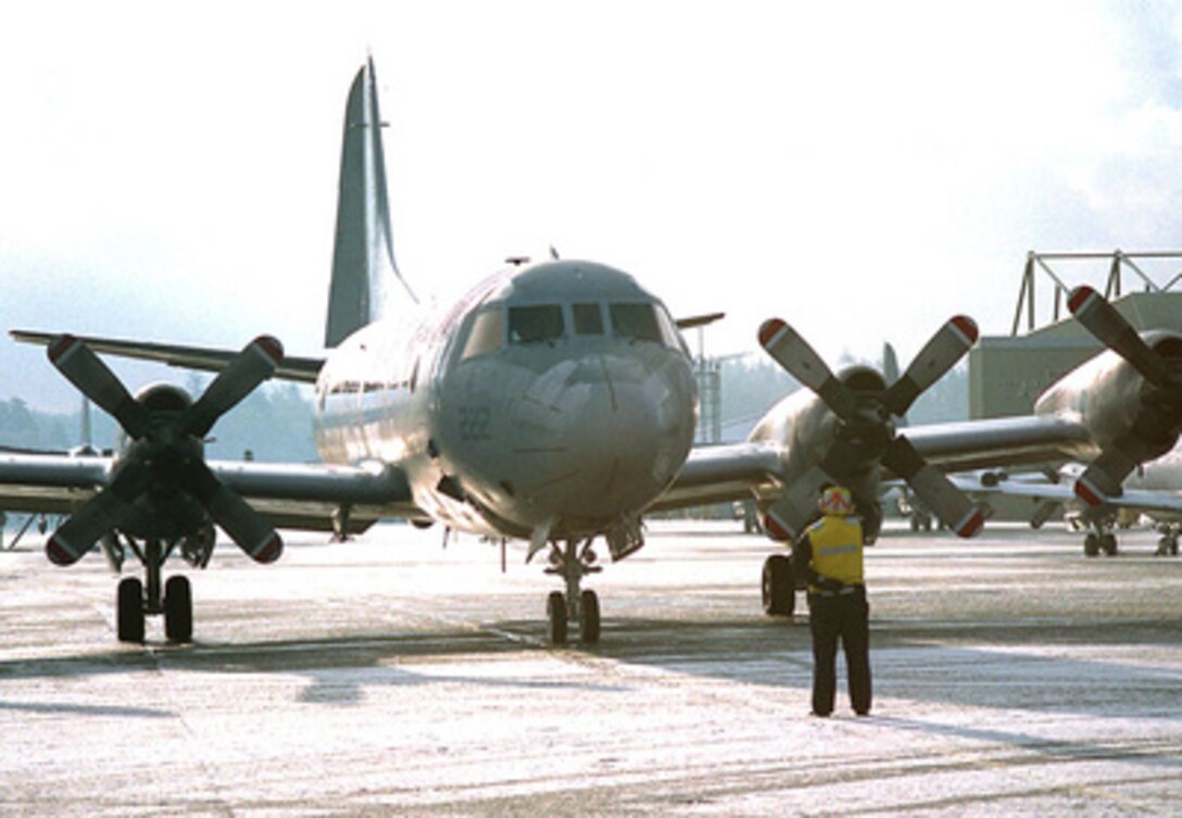 Petty Officer 1st Class Leslie Cleaver directs the aircrew in the flight station to begin engine starts on a U.S. Navy P-3C Orion aircraft at Naval Air Station, Whidbey Island, Wash., on Jan. 26, 1996. The Orion is a land-based, long range, anti-submarine warfare patrol and surface surveillance aircraft. It has advanced submarine detection sensors such as directional frequency and ranging sonobouys and magnetic anomaly detection equipment. Cleaver, from Westminister, Colo., is a Navy Parachute Rigger. The Orion belongs to Patrol Squadron 46. 