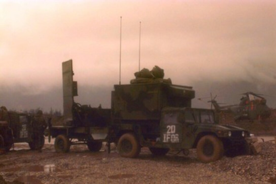 U.S. Army soldiers perform an operations check on a AN/TPQ-36 Fire Finder Radar erected behind the Sarajevo Aerodrome in Bosnia and Herzegovina on Dec. 27, 1995. The Fire Finder Radar has the capability to determine where a round was fired from, where it will land and will compute coordinates for a counterattack if needed. The radar can track artillery rounds, mortars, and rounds as small as .50-caliber. The soldiers are from Target Acquisition Battery Bravo, 25th Field Artillery Regiment, U.S. Army Europe and are deployed as part of the NATO Implementation Force (IFOR) in Bosnia and Herzegovina for Operation Joint Endeavor. 