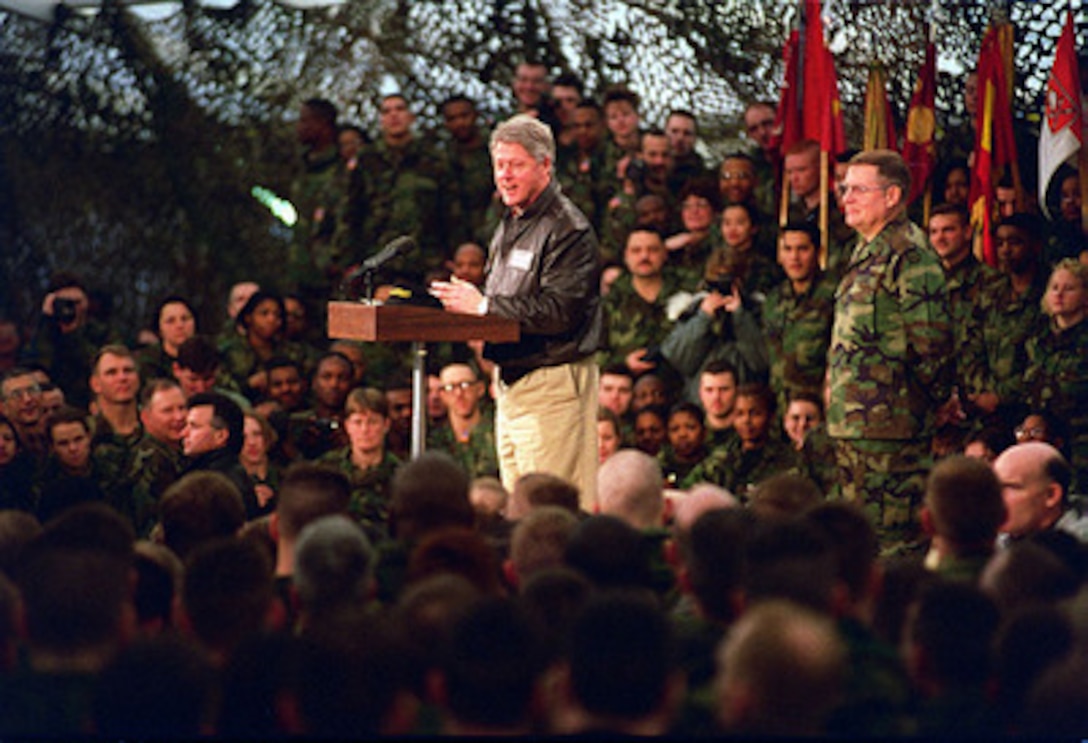 President Bill Clinton speaks to U.S. service men and women deployed to Hungary for Operation Joint Endeavor on Jan. 13, 1996. Lt. Gen. John N. Abrams, U.S. Army Europe (Forward) Commander, joined the president on the stage. President Clinton will also meet with U.S. troops in Bosnia and Herzegovina and Croatia. 
