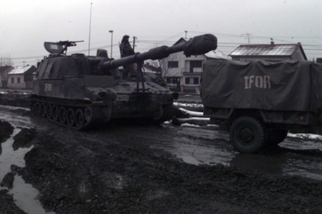A U.S. Army M-109 155mm Self-propelled Howitzer is prepared for a convoy through the streets of Zupanja, Croatia, towards the pontoon bridge on the Sava River on Jan. 2, 1996. The howitzer will join the NATO Implementation Force (IFOR) deployment into Bosnia and Herzegovina for Operation Joint Endeavor. The howitzer, from the 2nd Battalion, 3rd Field Artillery of the 1st Armored Division, was transported to Zupanja by rail from Kirch-Goens, Germany. 