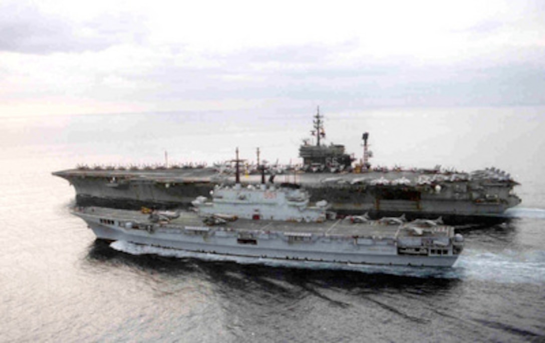 The Italian light aircraft carrier Giuseppe Garibaldi (C 551) (foreground) and the U.S. Navy aircraft carrier USS America (CV 66) conduct joint operations in the Adriatic Sea off the coast of Croatia on Jan. 19, 1996. The America and her battle group are operating in the Adriatic in support of the NATO Operation Joint Endeavor in Bosnia and Herzegovina. 
