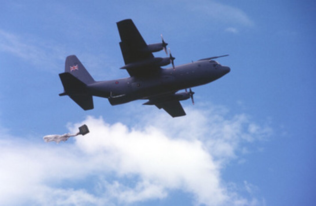 A Container Delivery System is pulled by a drag chute out of a United Kingdom Royal Air Force C-130 as it drops a bundle over the Bronco drop zone in eastern Washington state during Airlift Rodeo '96 on June 24, 1996. Airlift Rodeo '96 is the United States Transportation Command's tanker/airlift competition which tests the flight and ground skills of aircrews as well as the related skills of combat control, security police, aerial port, aeromedical evacuation, and maintenance team members. Crews from the U.S. and nine other countries are participating in the competition held this year at McChord Air Force Base, Wash. 