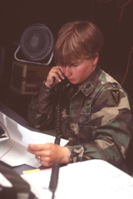 U.S. Army 2nd Lt. Michelle Isenhour, Battle Officer for the 16th Signal Battalion, maintains contact with deployed elements of the 16th from the base camp at MacGregor Reservation, N.M., on June 6, 1996, during exercise Roving Sands '96. Roving Sands '96 is the world's largest joint, tactical air defense exercise involving service men and women from the U.S., Germany, the Netherlands and Canada. The exercise allows multinational forces to practice tactics, techniques and procedures improving their defense capabilities. The 16th Signal Battalion is deployed for the exercise from Fort Hood, Texas. 