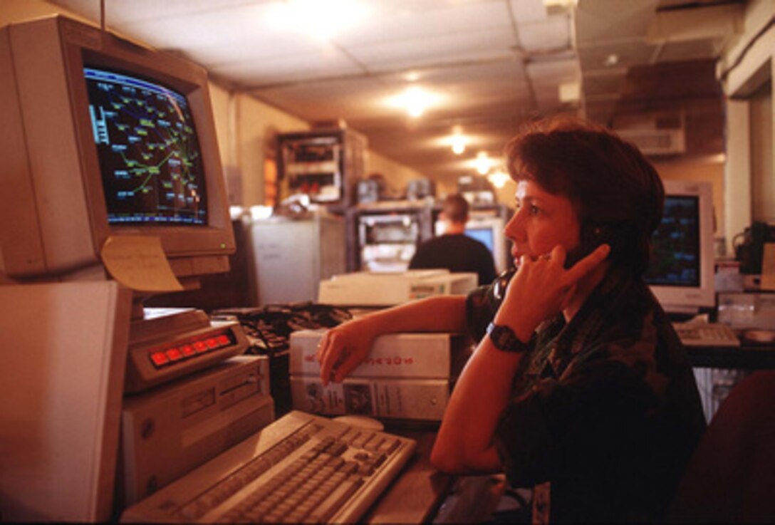 1st Lt. Cindy Krausch monitors her computer screen as she works in the 612th Air Communication Squadron's command center at Fort Bliss, El Paso, Texas, on June 10, 1996, for exercise Roving Sands '96. Roving Sands '96 is the world's largest joint, tactical air defense exercise involving service men and women from the U.S., Germany, the Netherlands and Canada. The exercise allows multinational forces to practice tactics, techniques and procedures improving their defense capabilities. Krausch is deployed from the 157th Air Controllers Group, Jefferson Barracks, St. Louis, Mo. 