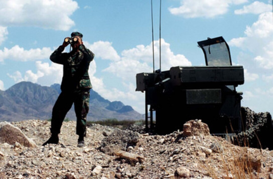 U.S. Marine Cpl. Orlando Villarreal, an Avenger Gunner from the 2nd Low Altitude Air Defense Squadron, keeps a lookout for hostile aircraft over the NASA Test Site at White Sands, N.M., on June 15, 1996, during Roving Sands '96. Roving Sands is the world's largest joint, tactical air defense exercise involving service men and women from the U.S., Germany, the Netherlands and Canada. The exercise allows multinational forces to practice tactics, techniques and procedures improving their defense capabilities. The 2nd Low Altitude Air Defense Squadron is deployed for the exercise from Cherry Point, N.C. 
