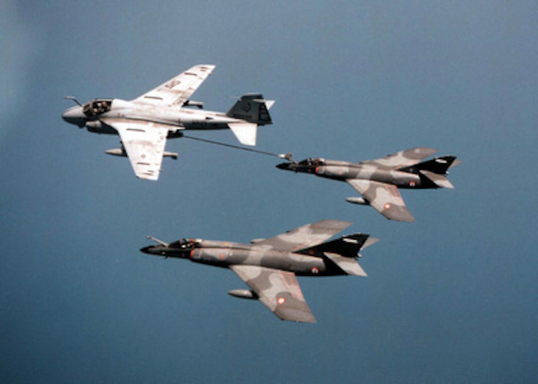 A U.S. Navy A-6E Intruder (left) performs in-flight refueling with a French Navy Super Etendard (right) while operating in the western Mediterranean Sea, June 19, 1996. The Intruder was flying from the deck of the aircraft carrier USS George Washington (CVN 73), while the Super Etendards were operating from the French aircraft carrier Clememceau (R 98). The two carriers and their aircraft used the opportunity to practiced underway replenishment and in-flight refueling respectively. The Intruder is attached to Attack Squadron 34, of Naval Air Station Oceana, Va. 