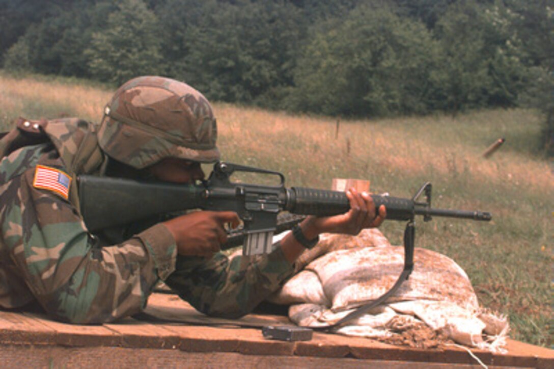 Staff Sgt. Charles Solomon fires a M16-A2 rifle for marksmanship qualifications at a range near Handalici, Bosnia and Herzegovina, during Operation Joint Endeavor on June 27, 1996. Solomon and others from the 141st Signal Battalion, Bad Kreuznach, Germany, are using the rifle range to maintain their qualifications while deployed as part of the NATO Implementation Force (IFOR) in Bosnia and Herzegovina. 