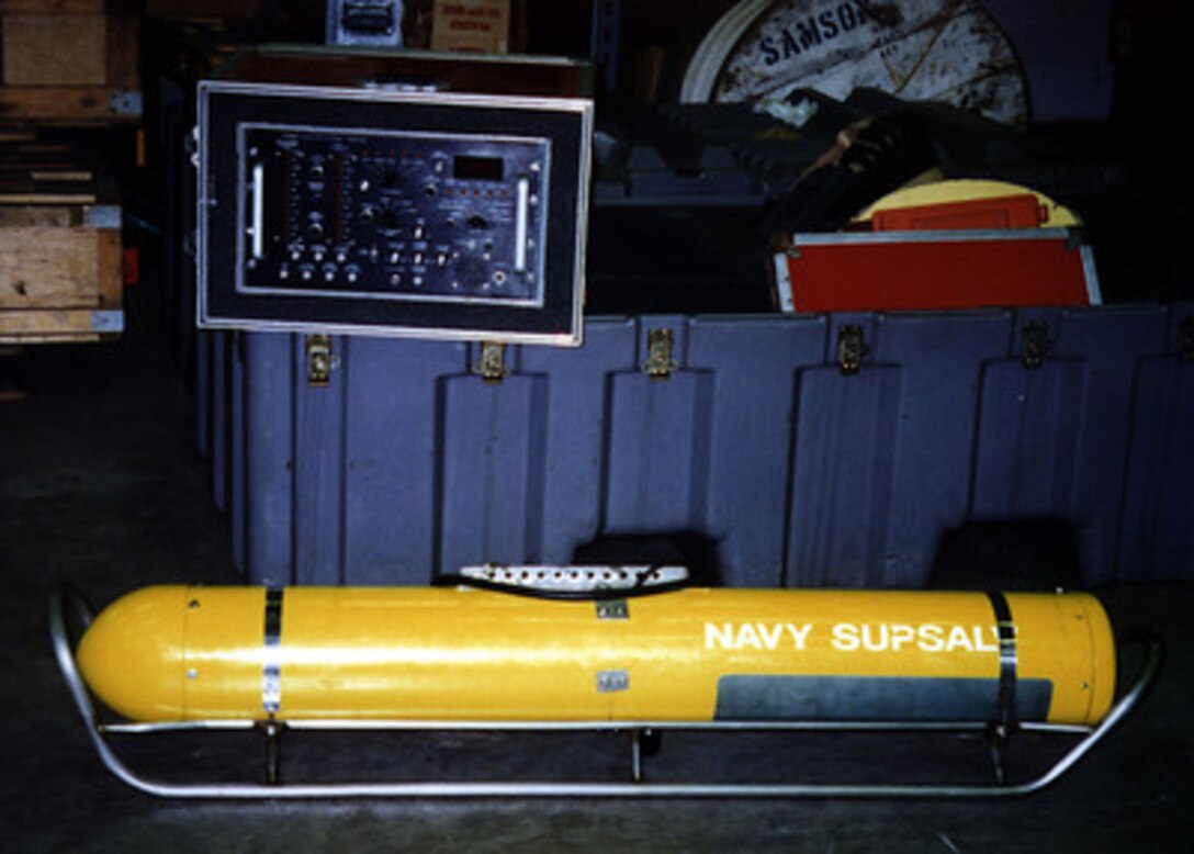 This Pinger Locator System is part of the Navy equipment being transported to the crash site of TWA Flight 800 to be used by the Navy in an attempt to locate the aircraft's flight data recorders more commonly known as Black Boxes. The PLS is a highly sensitive, underwater microphone which is towed in the water to listen for the pingers located on the flight data recorders. 