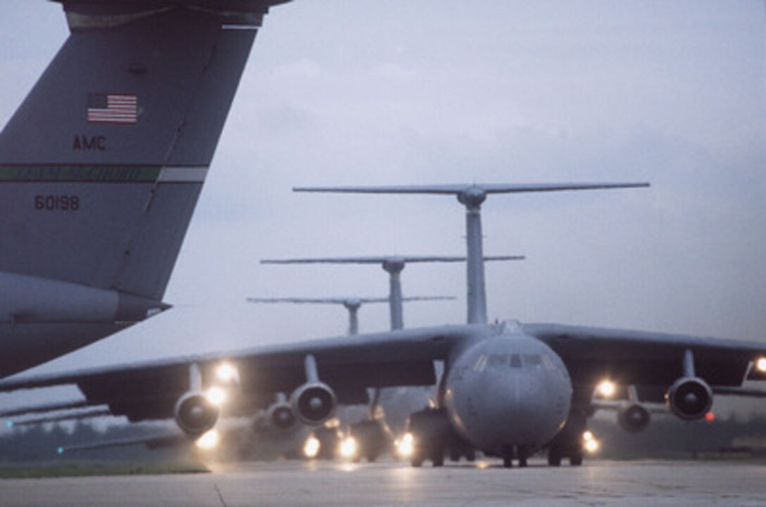 U.S. Air Force C-141B Starlifters line up for take off from Charleston Air Force Base, S.C., during Big Drop III on May 9, 1996. The aircraft will transport equipment and paratroopers to drop zones near Pope Air Force Base, N.C. The largest air drop since World War II, Big Drop III involves 144 aircraft and is part of the larger Combined Joint Task Force Exercise `96. More than 53,000 military service members from the United States and the United Kingdom are participating in Combined Joint Task Force Exercise '96 on military installations in the Southeastern United States and in waters along the Eastern seaboard. 