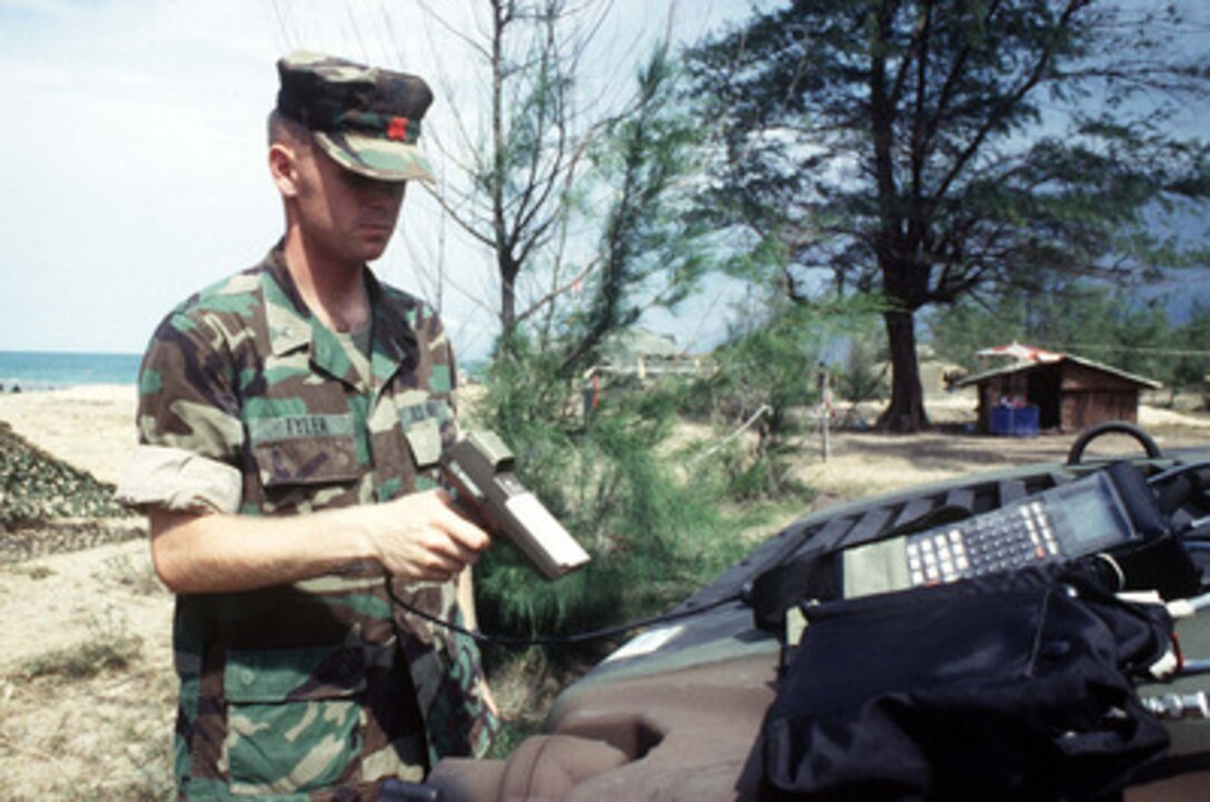 U.S. Marine Cpl. Eric K. Tyler scans a bar code label on the hood of a Humvee that has just hit the beach at Narathiwat, Thailand, on May 6, 1996, during a phase of Exercise Cobra Gold '96. The bar code helps generate an accurate inventory of equipment that has hit the beach during amphibious landings. Cobra Gold '96 is the latest in a continuing series of U.S. /Thai military exercises designed to ensure regional peace and strengthen the ability of the Royal Thai Armed Forces to defend Thailand. Approximately 9,000 U.S. and 10,000 Thai personnel are participating in the exercise. 