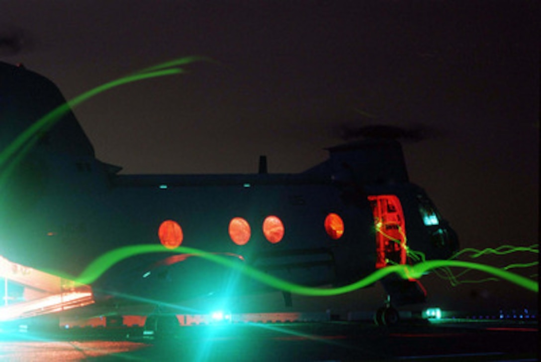 A CH-46 Sea Knight helicopter is readied for launch for night operations from the deck of the USS Nassau (LHA 4) on May 7, 1996, during Combined Joint Task Force Exercise '96. More than 53,000 military service members from the United States and the United Kingdom are participating in Combined Joint Task Force Exercise '96 on military installations in the Southeastern United States and in waters along the Eastern seaboard. 