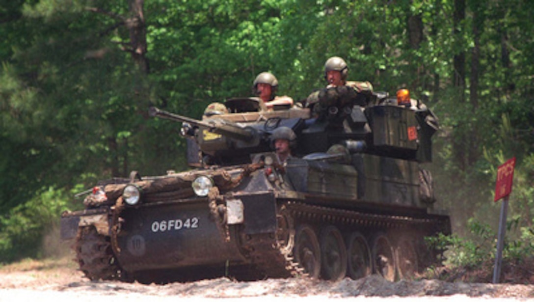 A British Royal Marine Combat Vehicle Reconnaissance (Tracked) Scorpion sits in a hide site during a 45 Commando assault at Camp Lejeune, N.C., on May 11, 1996, as part of Combined Joint Task Force Exercise '96. More than 53,000 military service members from the United States and the United Kingdom are participating in Combined Joint Task Force Exercise '96 on military installations in the Southeastern United States and in waters along the Eastern seaboard. 
