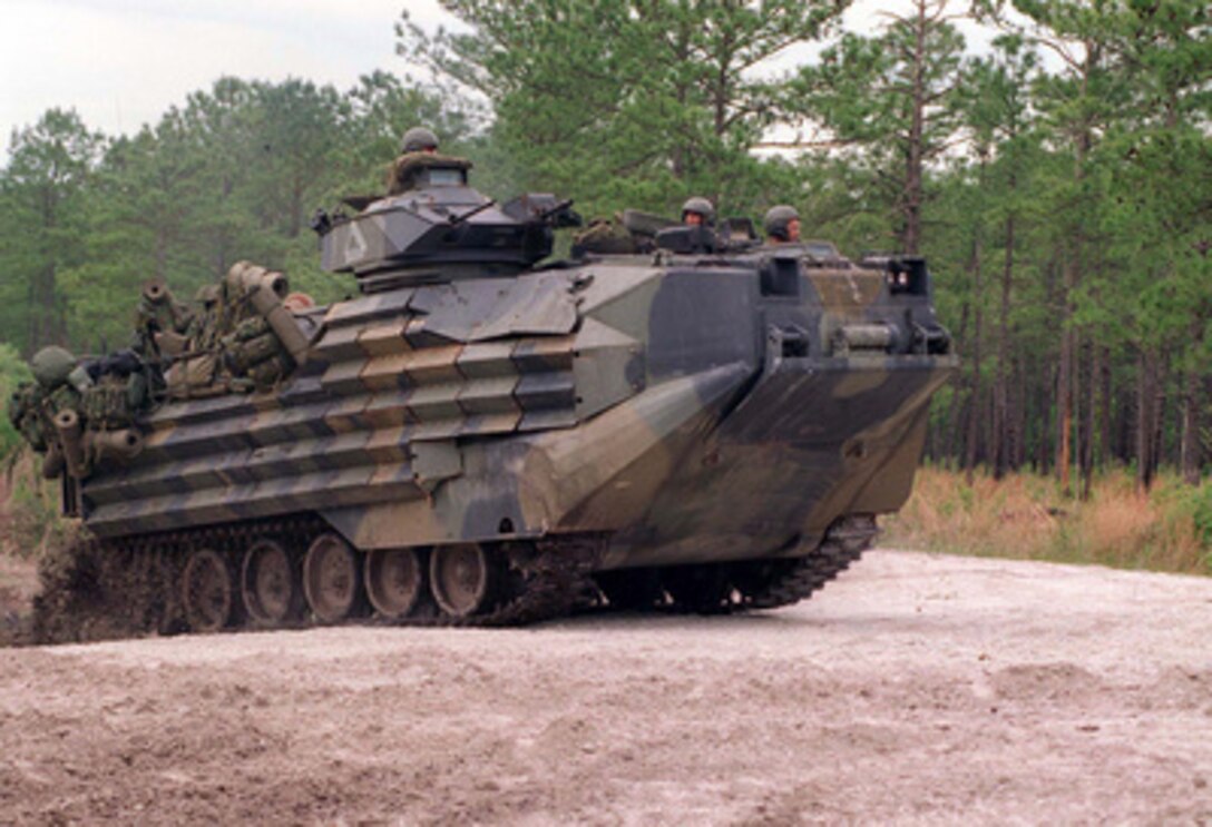 An Amphibious Assault Vehicle belonging to Delta Company, 2nd Amphibious Assault Battalion speeds towards the enemy during an assault by Marines of Kilo Company at Camp Lejeune, N.C., on May 13, 1996, as part of Combined Joint Task Force Exercise '96. More than 53,000 military service members from the United States and the United Kingdom are participating in Combined Joint Task Force Exercise '96 on military installations in the Southeastern United States and in waters along the Eastern seaboard. 