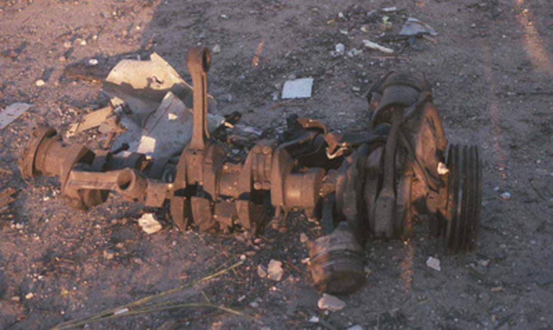 U.S. and Saudi investigators have began gathering evidence as they investigate the damage to Khobar Towers caused by the explosion of a fuel truck outside the northern fence of the facility on King Abdul Aziz Air Base near Dhahran, Saudi Arabia, at 2:55 p.m. EDT, Tuesday, June 25, 1996. This crankshaft is one of the largest pieces of the truck found. Several buildings were damaged and there were numerous U.S. casualties. The latest information from Dhahran indicates that 19 people are dead and 64 people are hospitalized. Additionally, over 200 have been treated for injuries and released. The facility houses U.S. service members and serves as the headquarters for the U.S. Air Force's 4404th Wing (Provisional), Southwest Asia. 